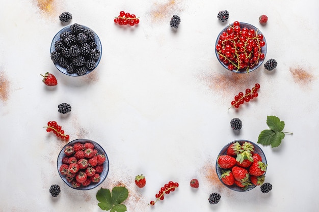 Various fresh summer berries,blueberries,red currant,strawberries,blackberries,top view.