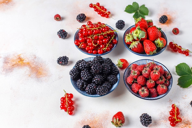 Free photo various fresh summer berries,blueberries,red currant,strawberries,blackberries,top view.