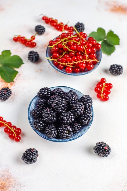 Various fresh summer berries, blueberries, red currant, strawberries, blackberries, top view.