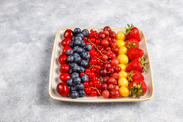 Various fresh summer berries, blueberries, red currant, top view.