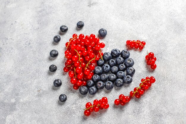 Various fresh summer berries, blueberries, red currant, top view.