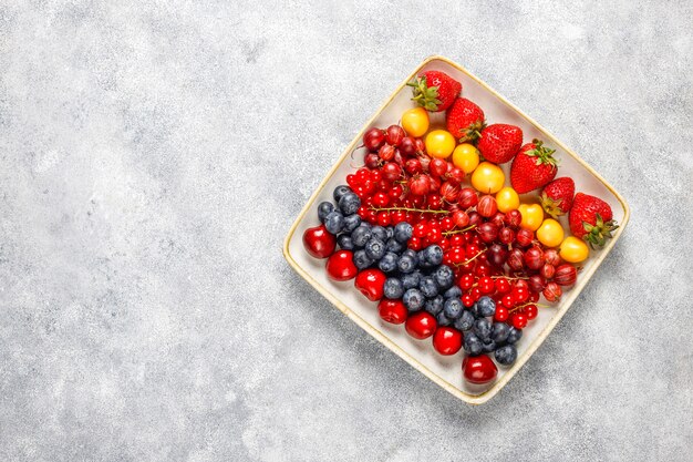 Various fresh summer berries,blueberries,red currant,top view.