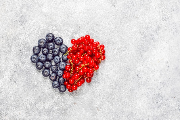 Various fresh summer berries, blueberries, red currant, top view.