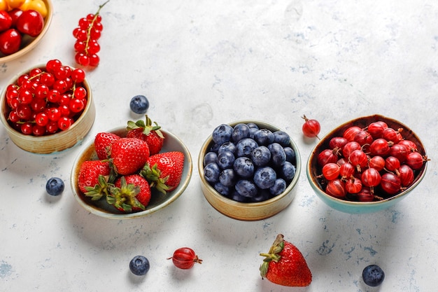 Various fresh summer berries, blueberries, red currant, top view.