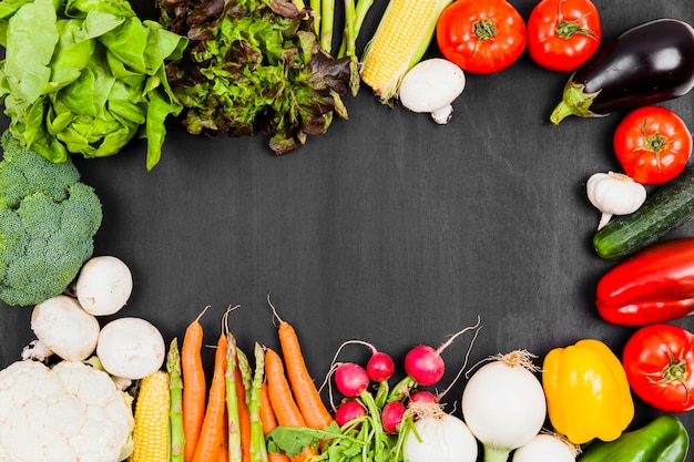 Various fresh vegetables with space in middle