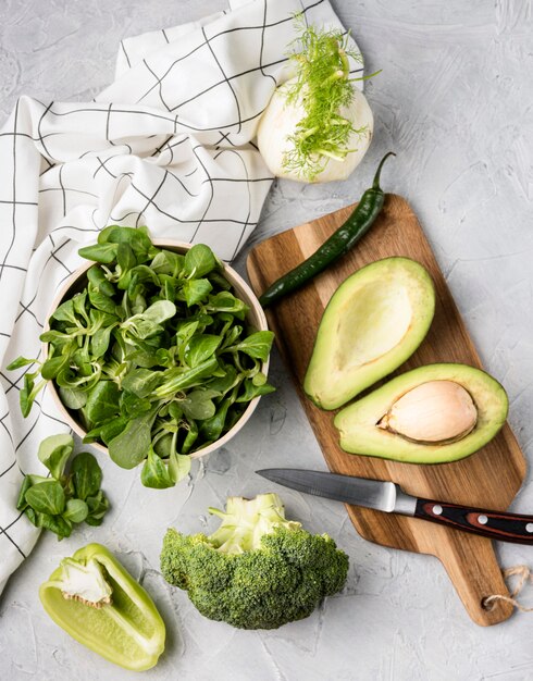 Various green veggies and kitchen cloth