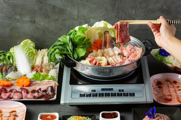 Free photo various ingredients of shabu hot pot with sauce