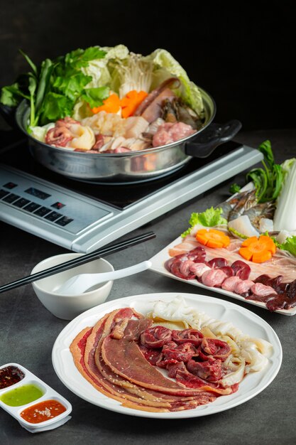 Various ingredients of shabu hot pot with sauce