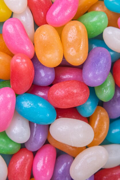 Various jelly beans on the blue background