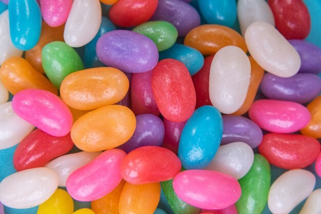 Various jelly beans on the blue background