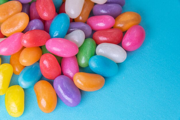 Various jelly beans on the blue background