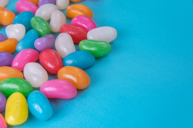 Various jelly beans on the blue background