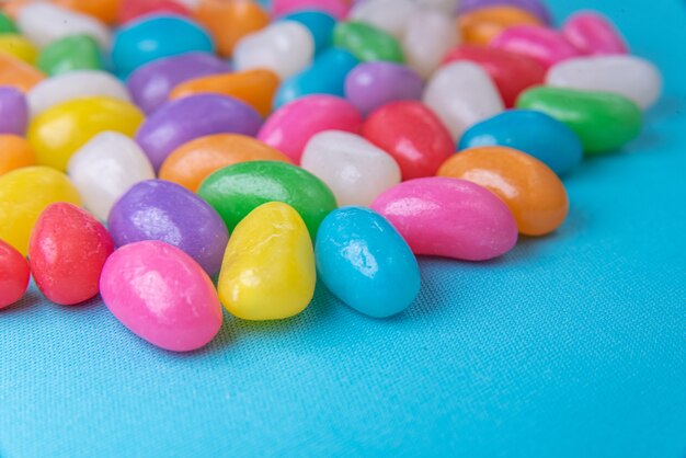 Various jelly beans on the blue background