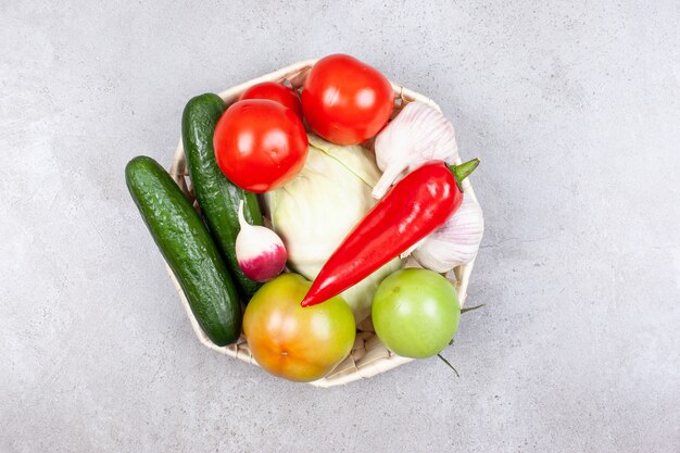 Various kinds of ripe organic vegetables in basket 