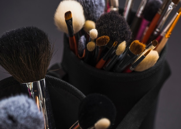 Various makeup brushes in holder