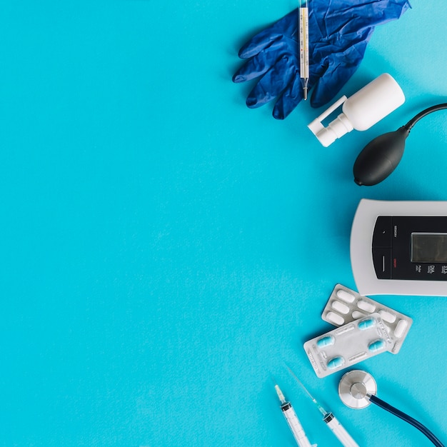 Various medical equipments on blue backdrop