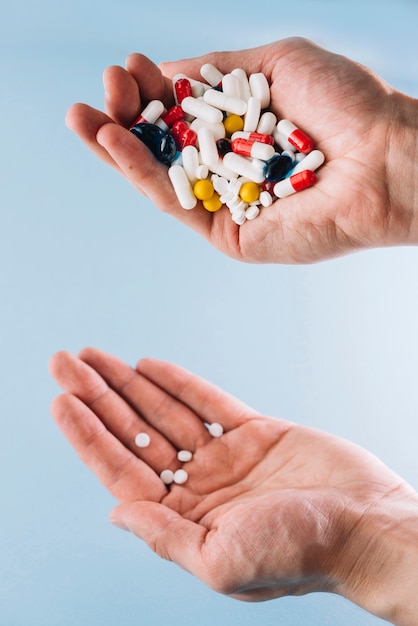 Various pills in hand