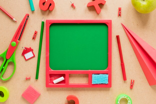 Various school supplies on beige background