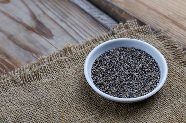 Various seeds - sesame, flax seed, flax seeds, pumpkin seed, poppy, chia in bowls on a rustic . Copy .