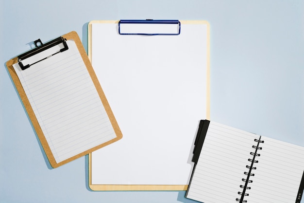 Various sizes of clipboard and notebook top view