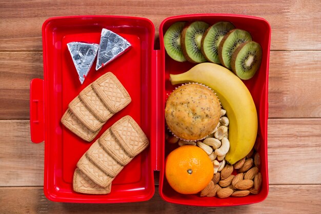 Various snack and fruit in lunch box