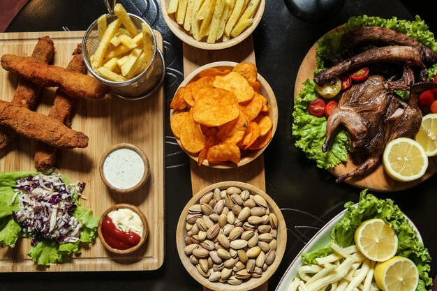 Various snacks for beer on the table top view