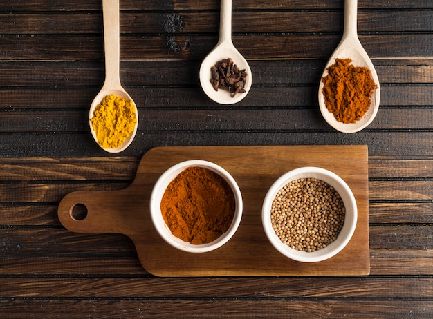 Various spices near cutting board