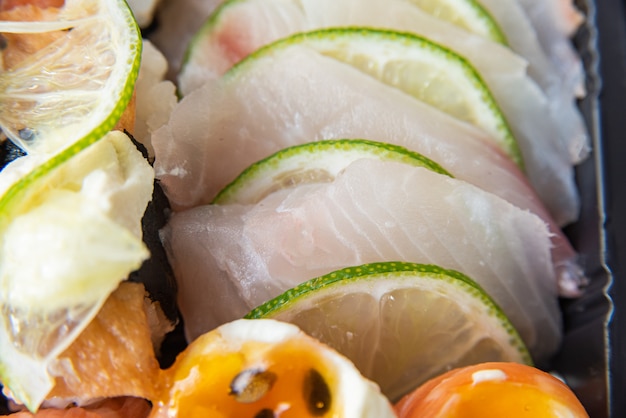 Various sushi on the plate on the table - detail