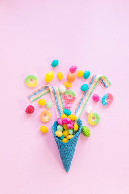 Various sweets on pink background