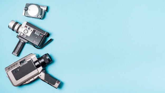 Various type of camcorder on blue background