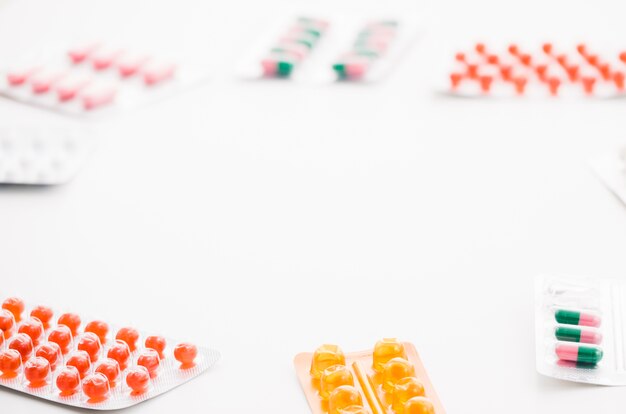 Various type of colorful pills isolated on white background with space for writing the text