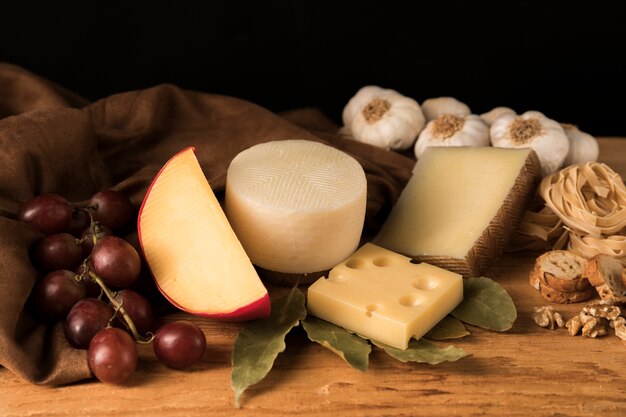 Various types of cheeses on kitchen counter