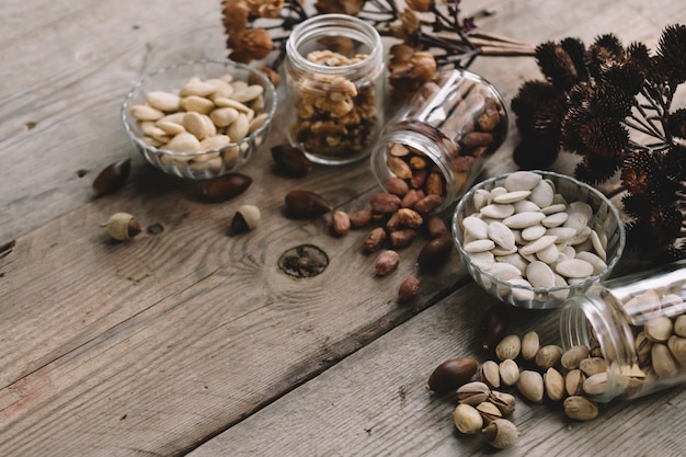 Various types of nuts on wooden surface