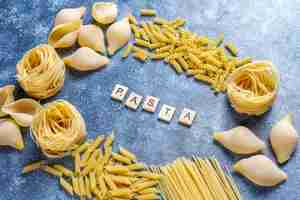 Free photo various types of uncooked pasta.