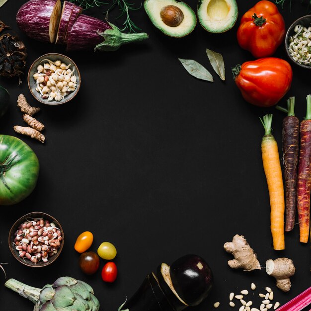 Various vegetables on black background with copy space for text