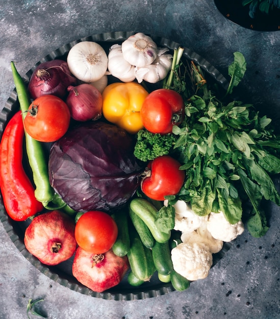 Various vegetables and herbs in plate