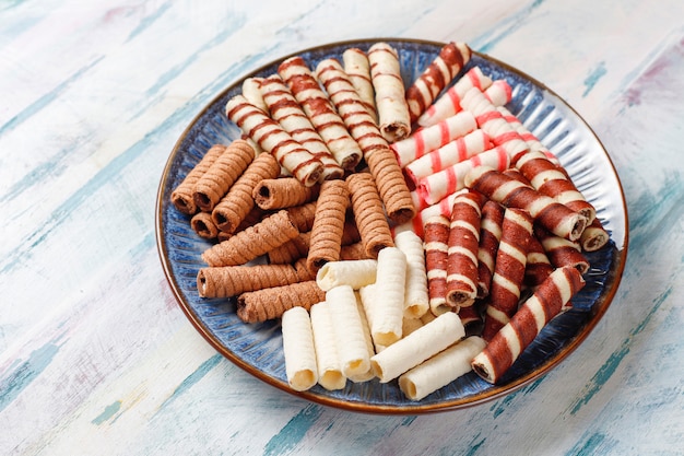 Various waffle rolls in ceramic plates