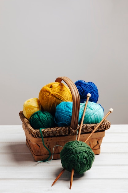 Free photo various wool balls in basket