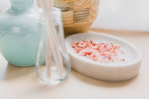 Vase and bottle near aroma salt