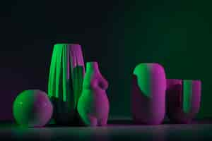 Free photo vases with green and pink light