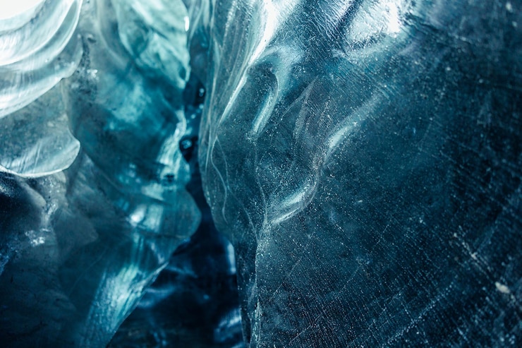 Free Photo vatnajokull caves are home to amazing ice formations, including large blue frozen blocks of ice. due to global warming issues, ice clear glaciers and glacial crevasses disappeared.