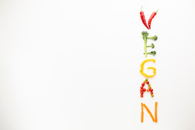 Vegan lettering made out of vegetables with copy space