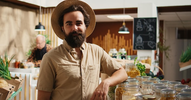 Free photo vegan man buys organic supermarket food