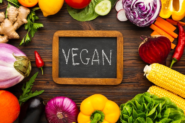 Vegetable arrangement with vegan lettering on chalkboard