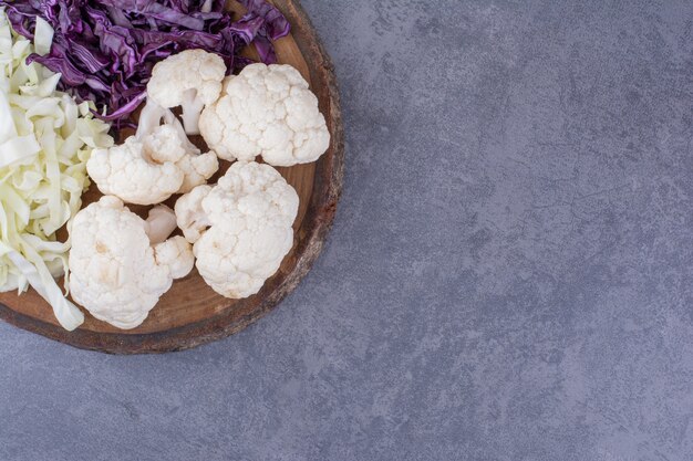 Vegetable board with cabbage and cauliflowers.