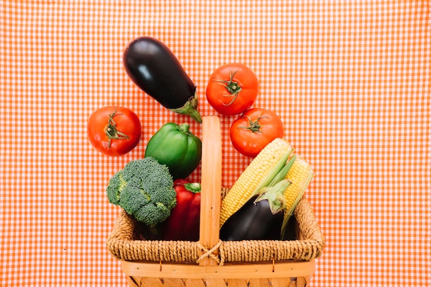 Vegetable composition on cloth with basket