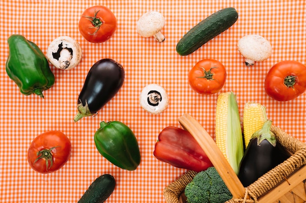 Free photo vegetable composition on table cloth