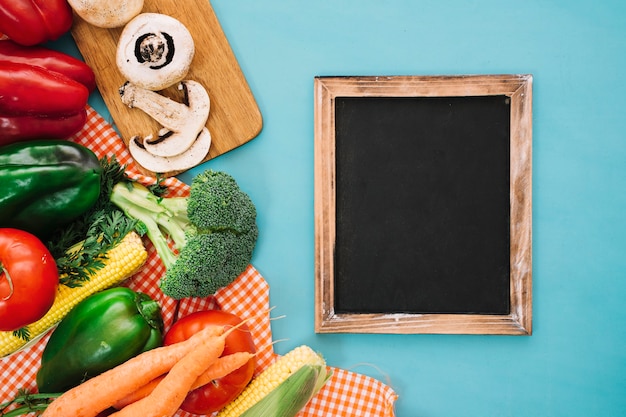 Free photo vegetable composition with slate on right