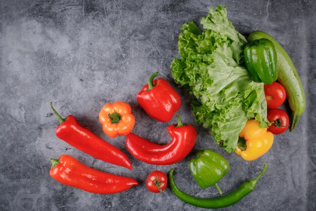 Vegetable framing with peppers and greenery.