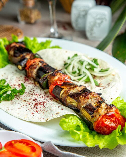  vegetable kebab on pita bread with herbs and onions